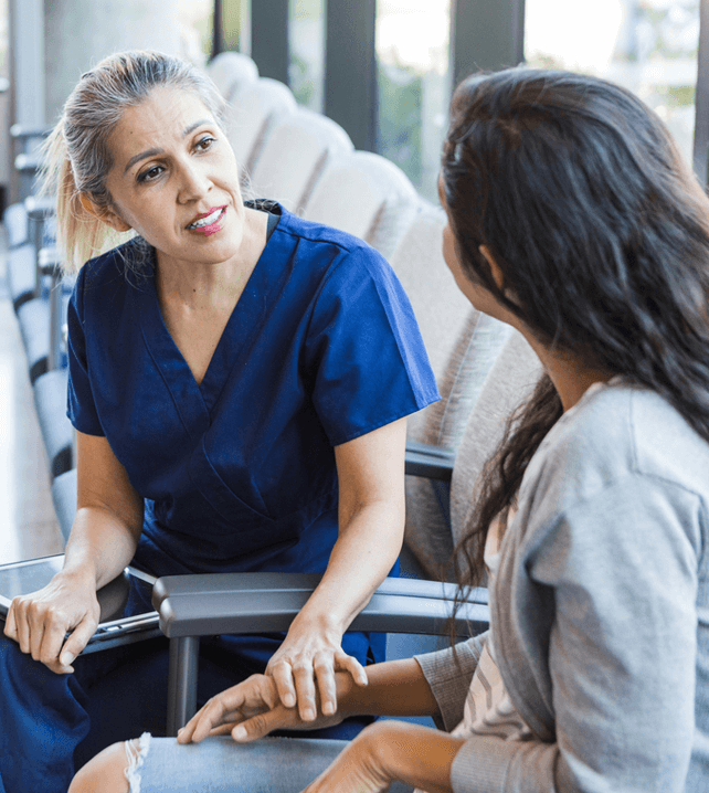 Primary care doctor talking to patient