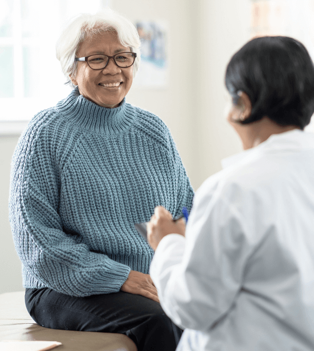 patient talking to elderly patient