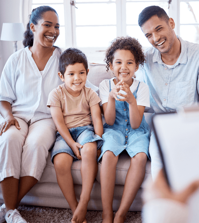 parents and their kids smiling