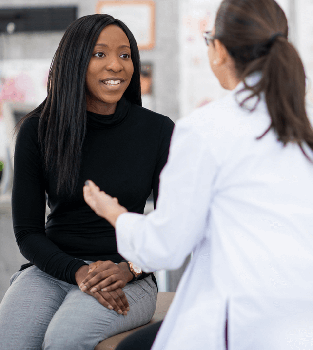 women's health doctor talking to female patient